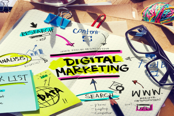 Colourful Desk with Tools and Notes About Digital Marketing